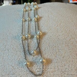 faux pearls on a gold tone chain